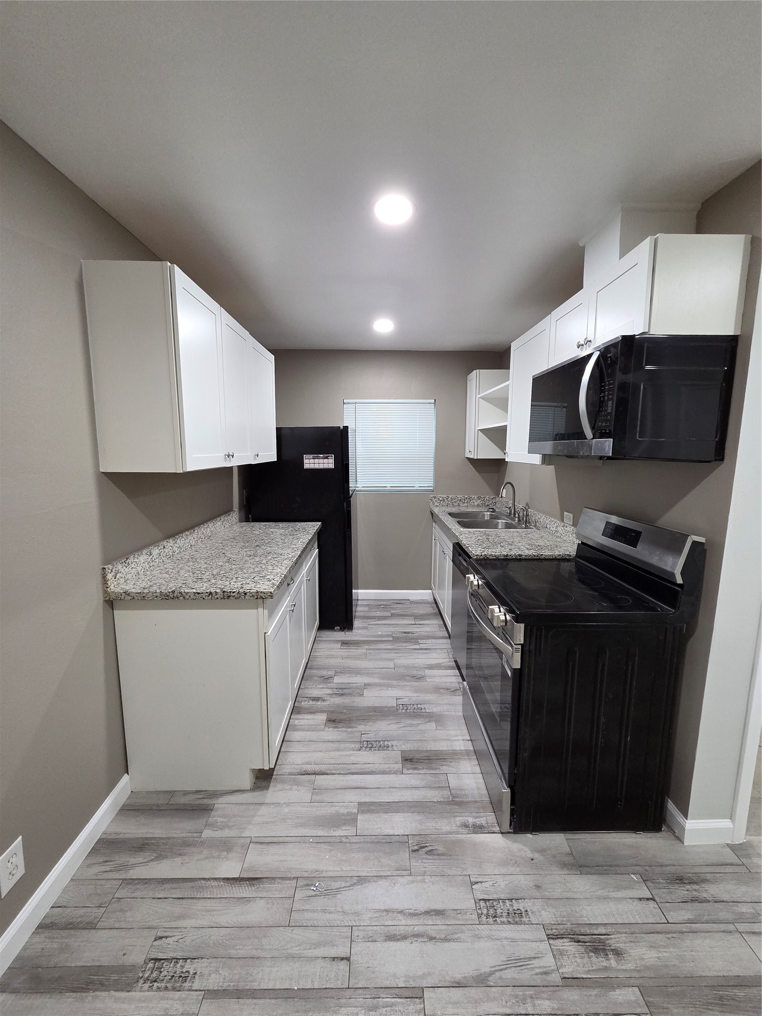 619 13th Street, Unit 2 Galveston, TX 77550 - Photo 2 of 13 Another view of the galley kitchen.