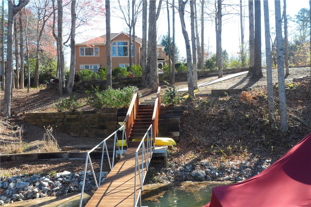 435 Cane Creek Landing Road, Unit SENECA Seneca, SC 29672 - Photo 11 of 43 Back of home from the boat dock. Gentle slope.