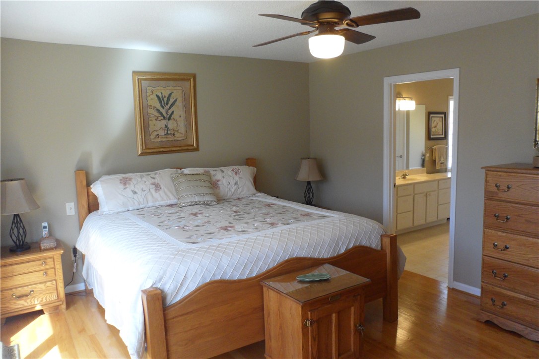 435 Cane Creek Landing Road, Unit SENECA Seneca, SC 29672 - Photo 21 of 43 Large master bedroom suite with hardwood floors.