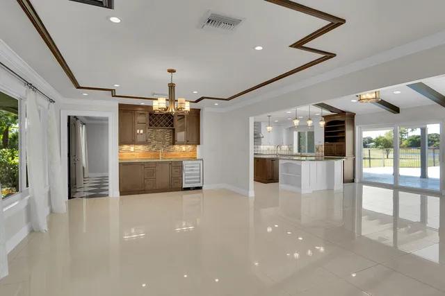 a view of a kitchen with a sink and a kitchen view