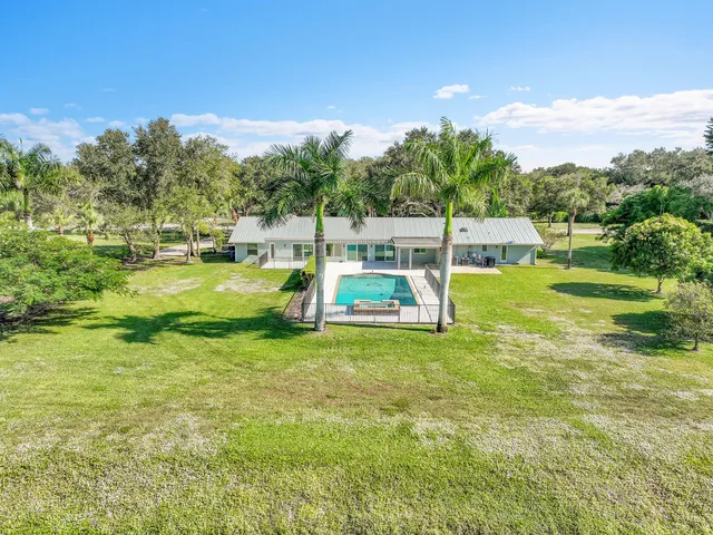 a view of a house with a big yard