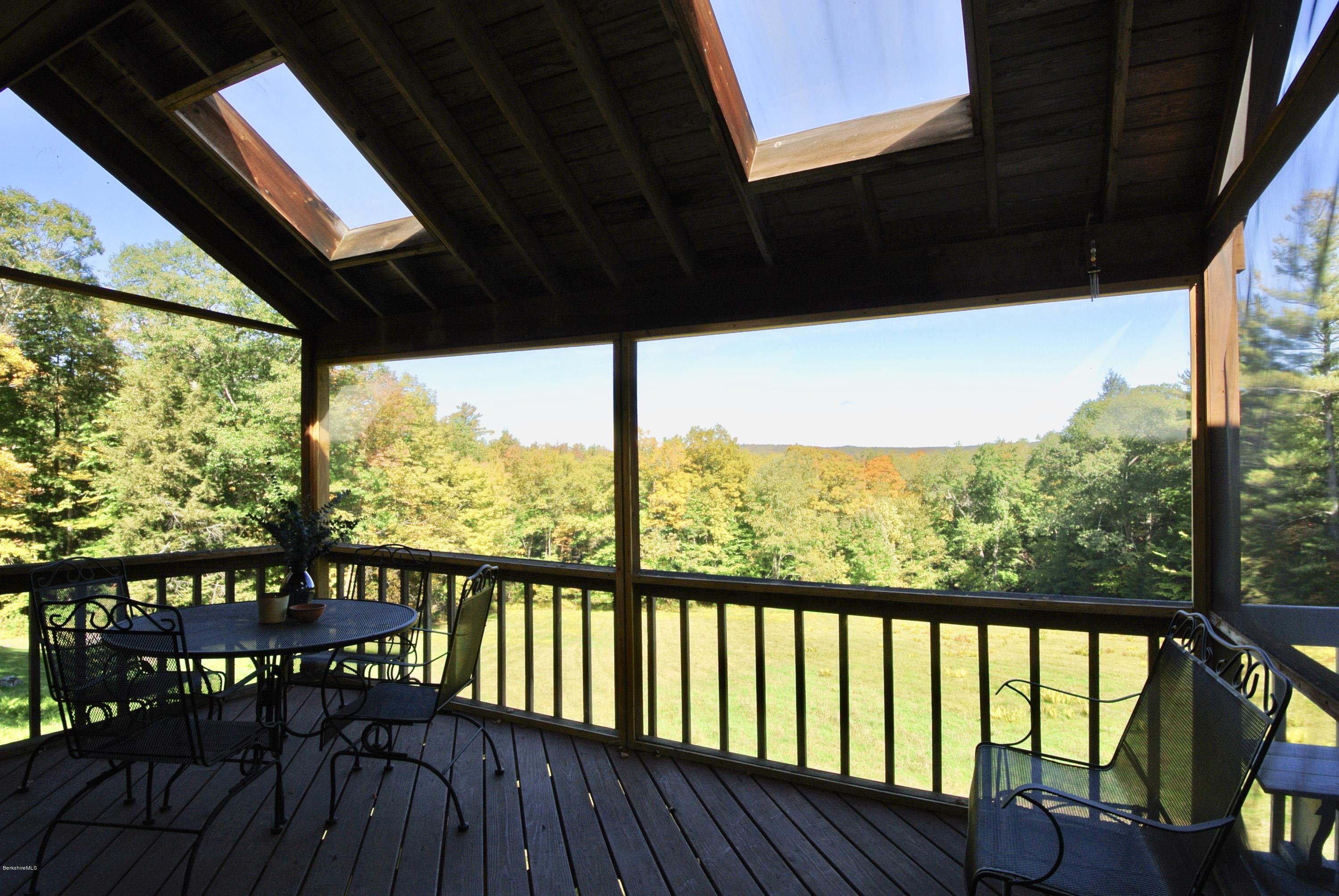 101 Judd Road Otis, MA 01253 - Photo 12 of 29 a view of a balcony with chairs