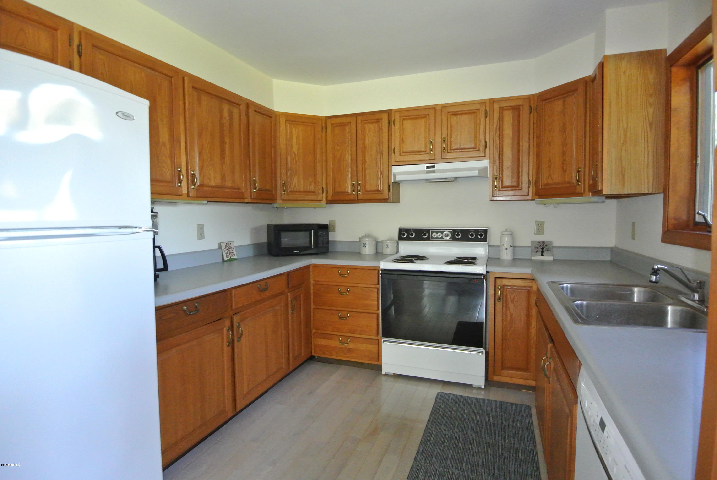 101 Judd Road Otis, MA 01253 - Photo 13 of 29 a kitchen with stainless steel appliances granite countertop a sink stove and refrigerator