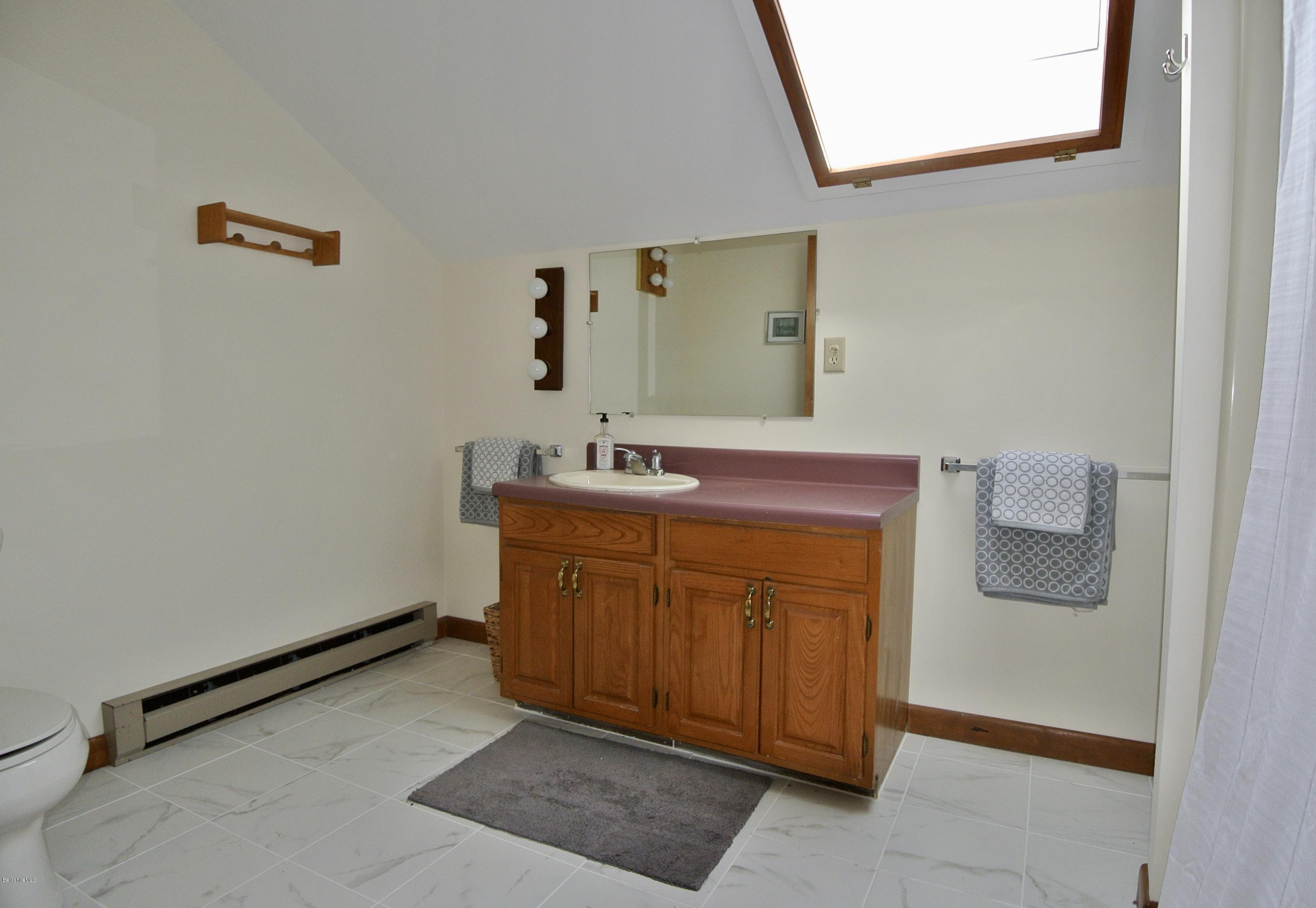 101 Judd Road Otis, MA 01253 - Photo 20 of 29 a bathroom with a sink and a mirror