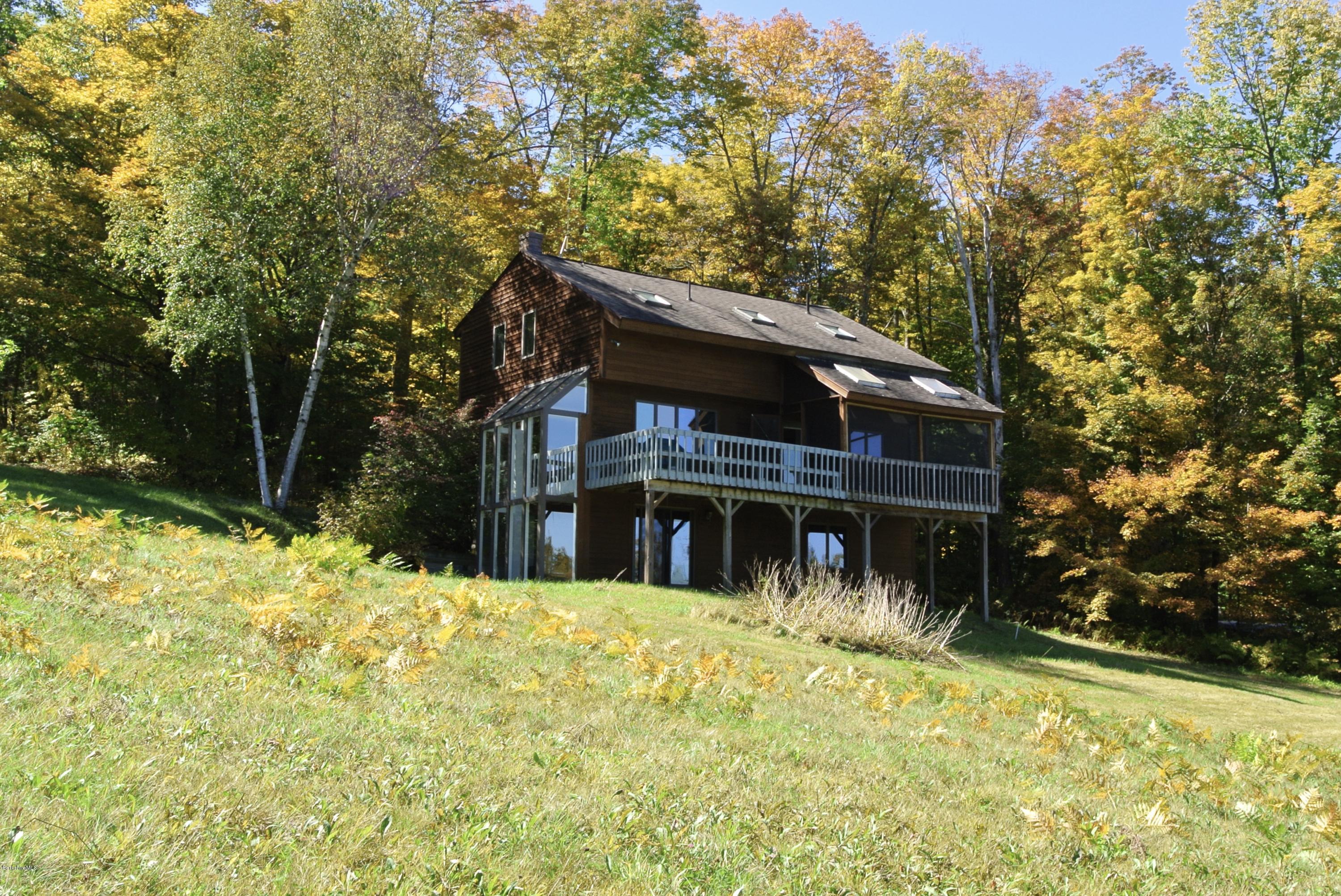 101 Judd Road Otis, MA 01253 - Photo 24 of 29 a house with trees in the background