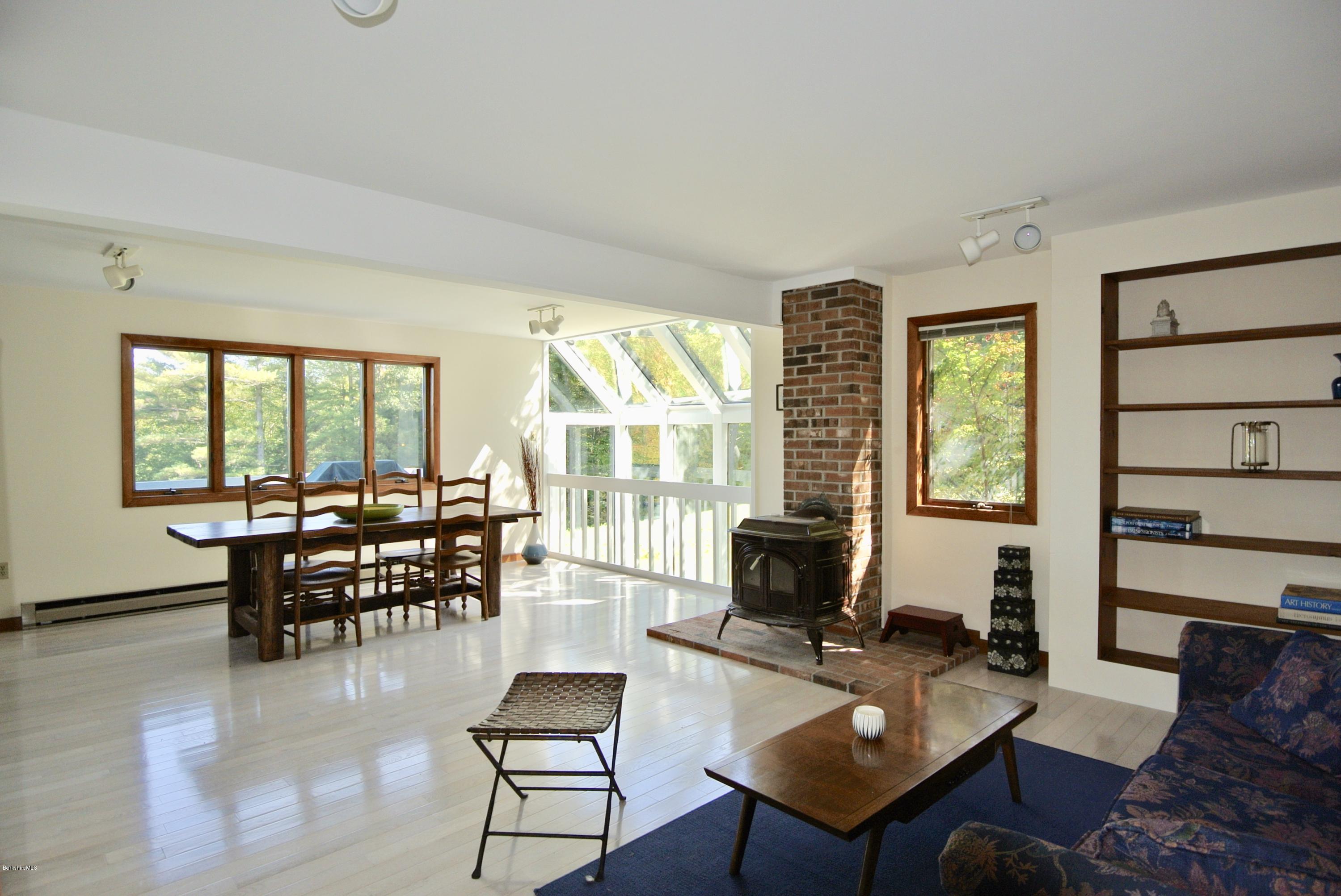 101 Judd Road Otis, MA 01253 - Photo 4 of 29 a living room with furniture and large windows