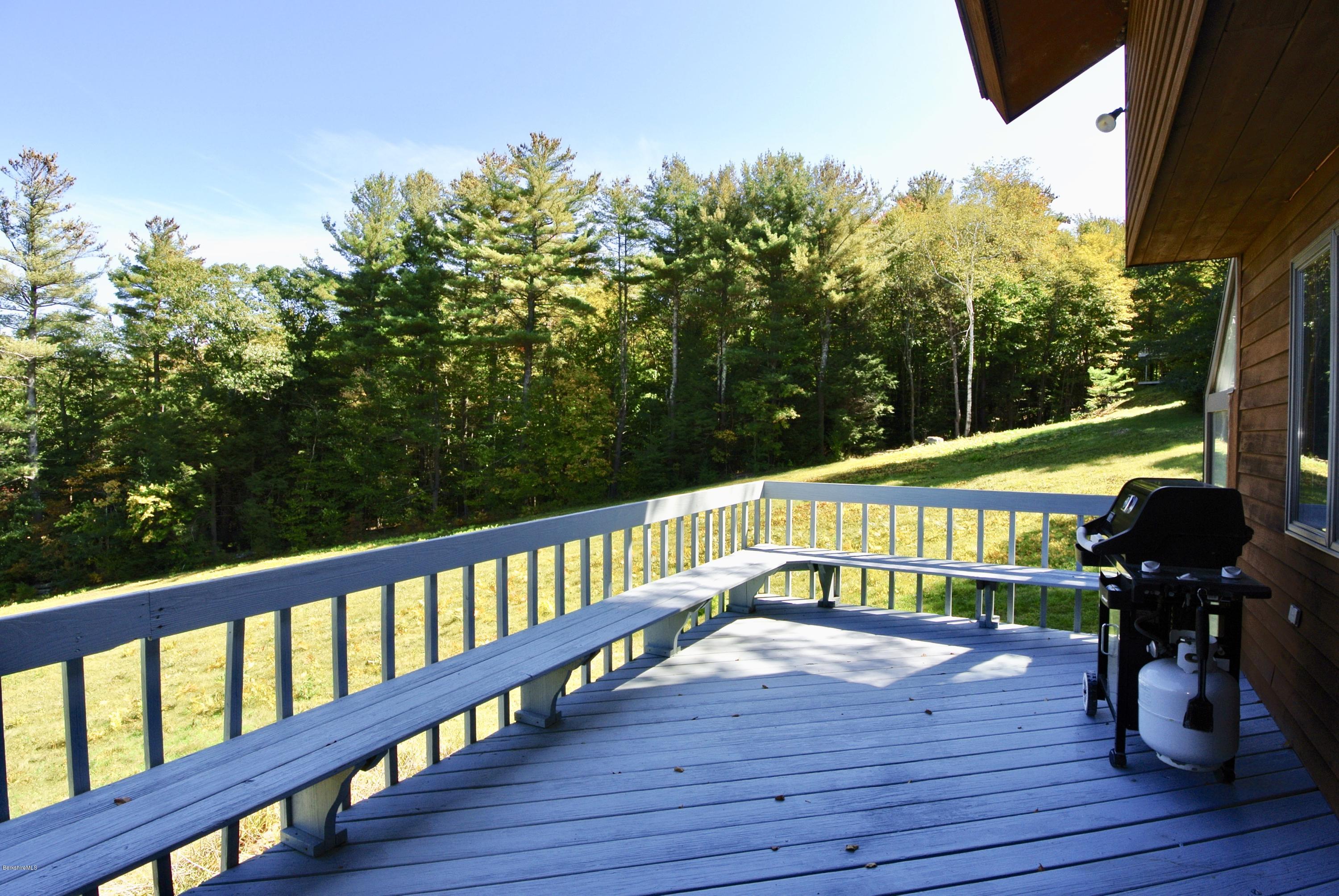 101 Judd Road Otis, MA 01253 - Photo 8 of 29 a view of a deck with a yard