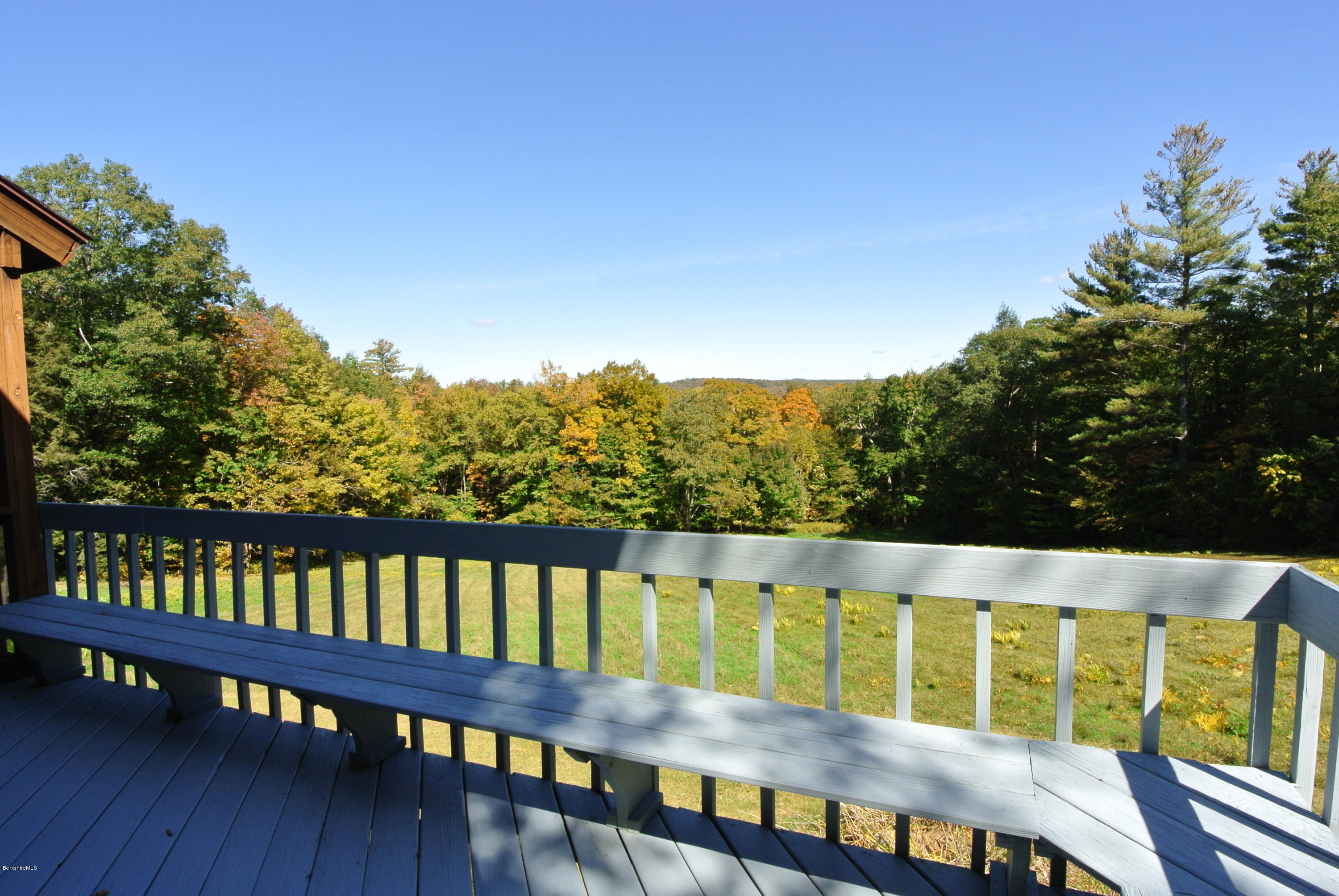101 Judd Road Otis, MA 01253 - Photo 10 of 29 a view of a balcony with wooden floor and outdoor space