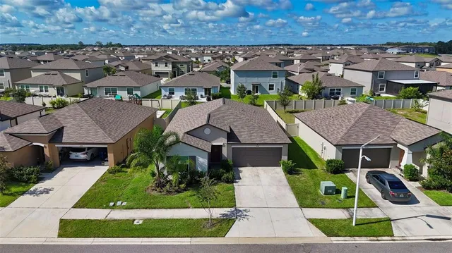 an aerial view of a house with a garden