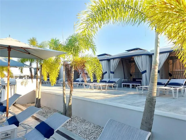 a patio with table and chairs