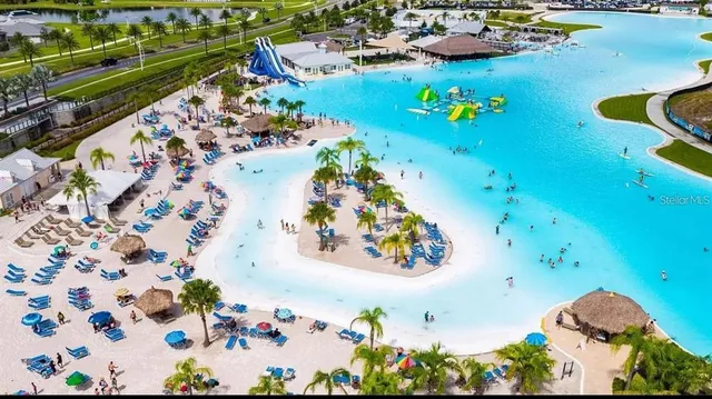 an aerial view of a swimming pool patio swimming pool and outdoor seating