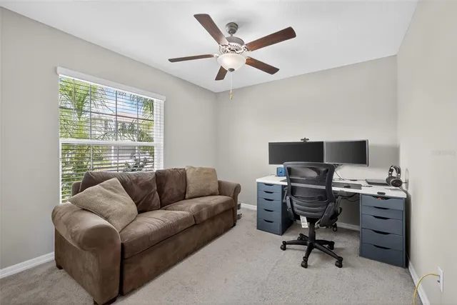 a work room with furniture and a window