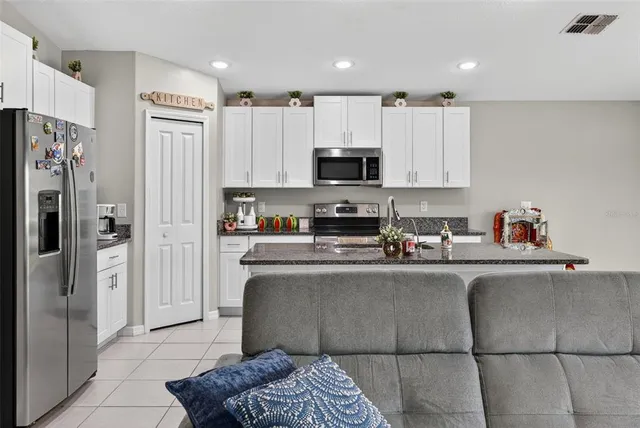 a view of a dining room with furniture and a window
