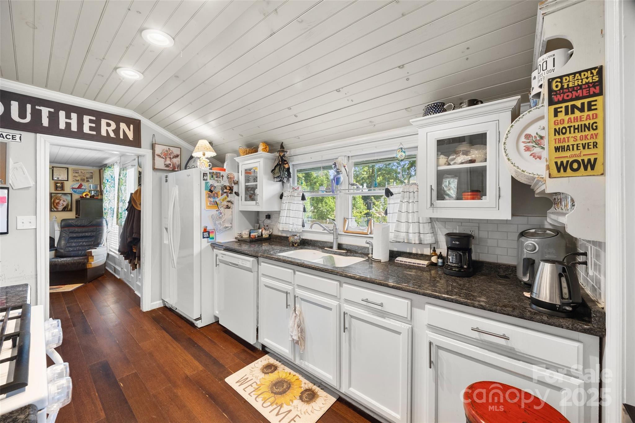 205 East Jefferson Street York, SC 29745 - Photo 11 of 35 a kitchen with stainless steel appliances granite countertop a stove and a sink