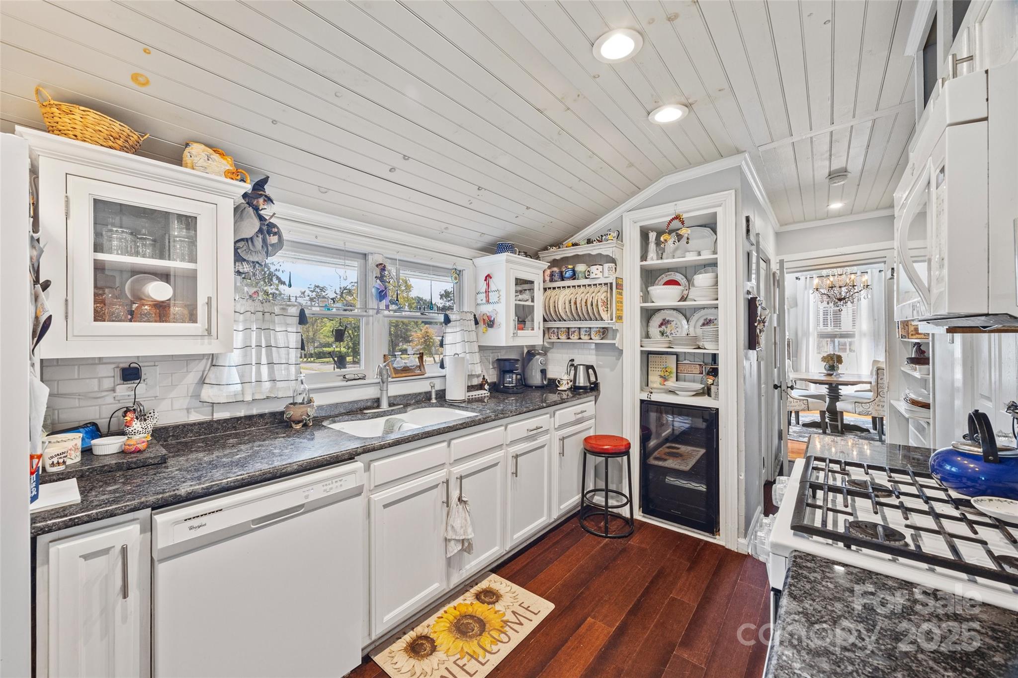 205 East Jefferson Street York, SC 29745 - Photo 12 of 35 a kitchen with stainless steel appliances granite countertop a sink and cabinets