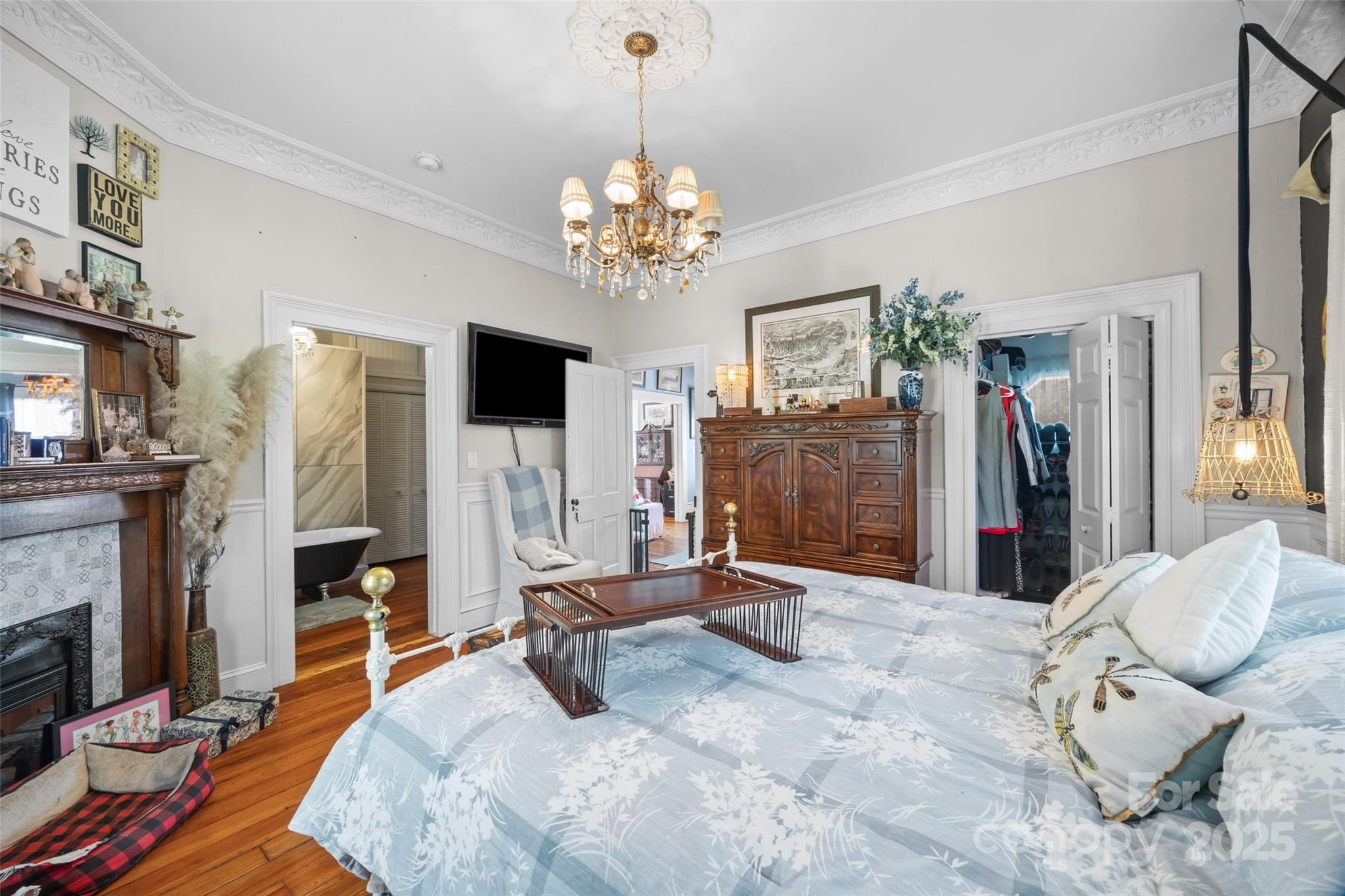 205 East Jefferson Street York, SC 29745 - Photo 16 of 35 a bedroom with a bed and a flat screen tv