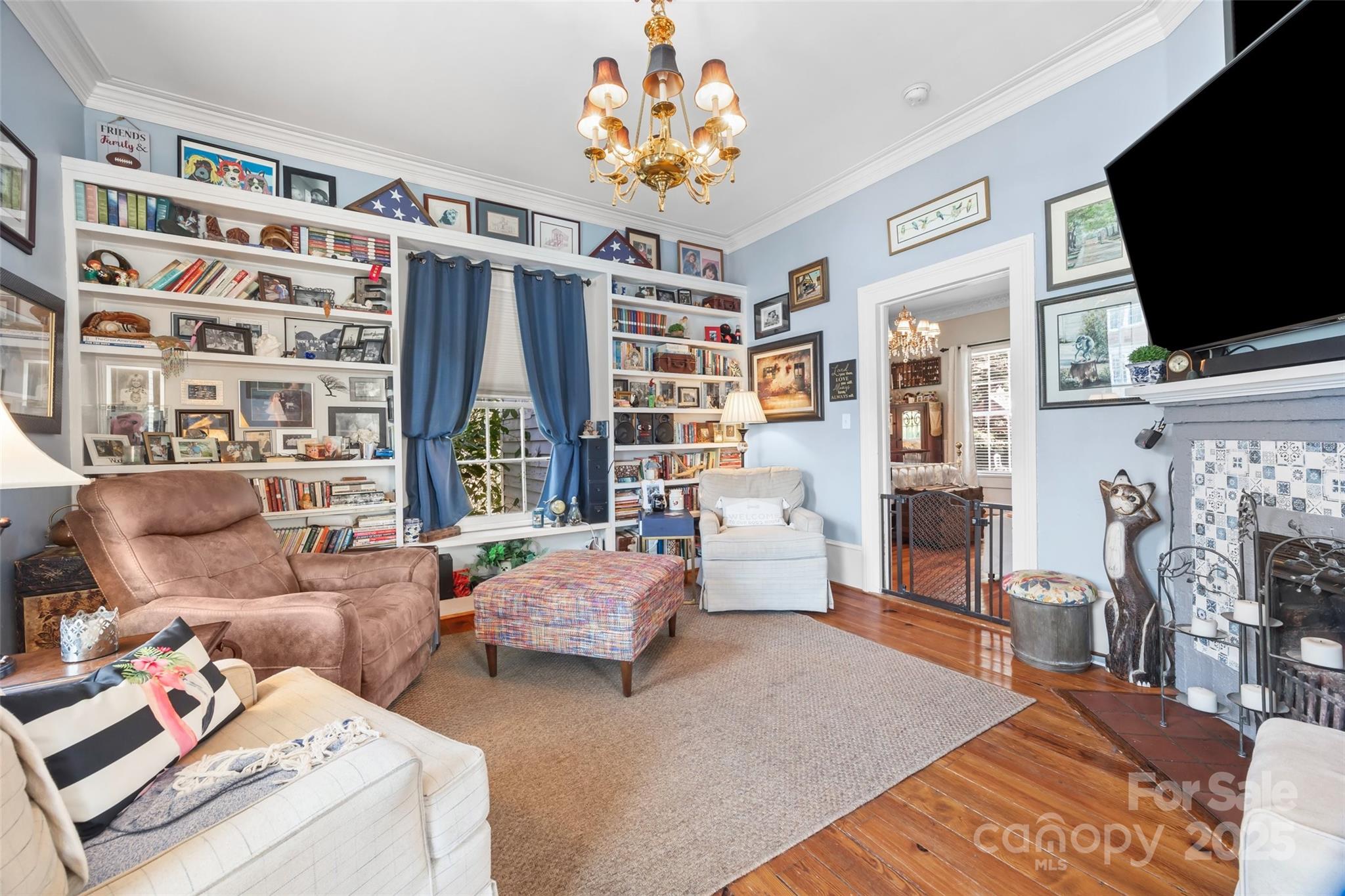 205 East Jefferson Street York, SC 29745 - Photo 6 of 35 a living room with furniture and a flat screen tv