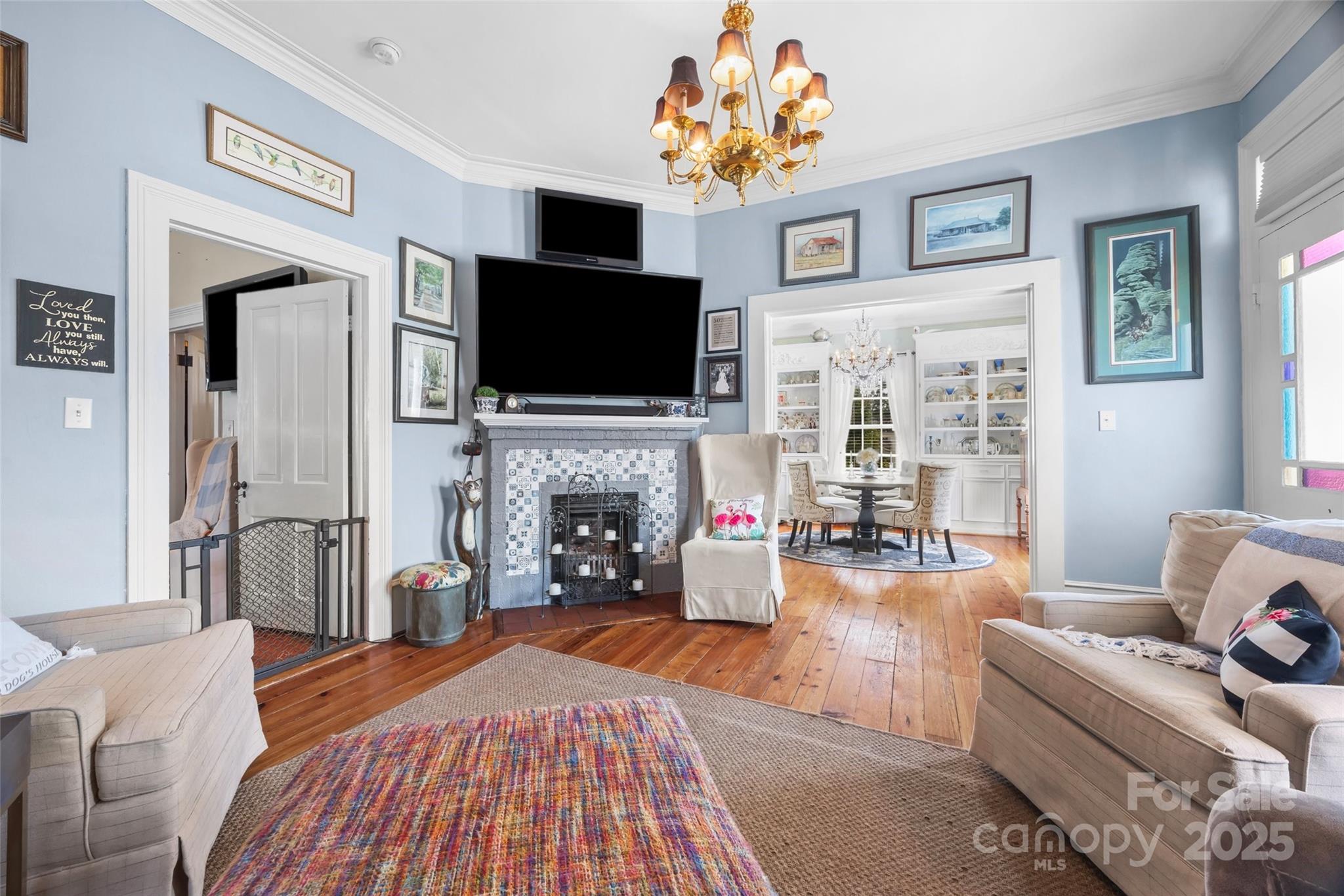 205 East Jefferson Street York, SC 29745 - Photo 7 of 35 a living room with fireplace furniture and a flat screen tv