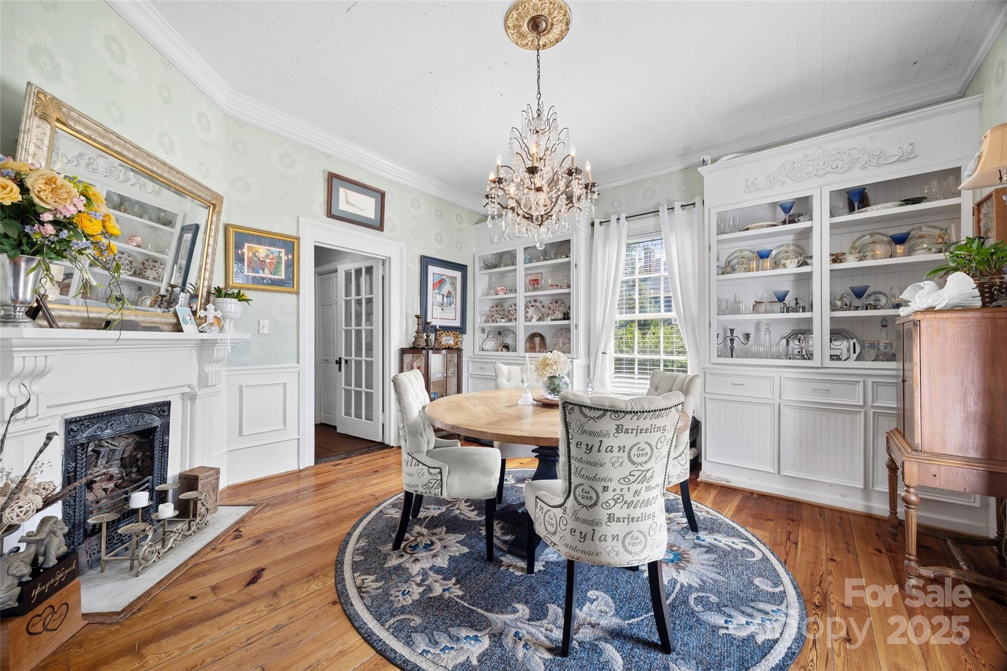 205 East Jefferson Street York, SC 29745 - Photo 8 of 35 a living room with furniture a fireplace and a chandelier