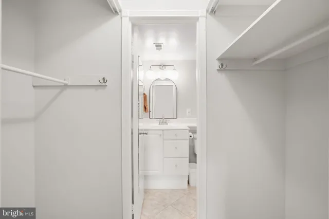 a bathroom with a sink toilet and mirror