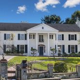 a front view of a house with swimming pool yard and outdoor seating