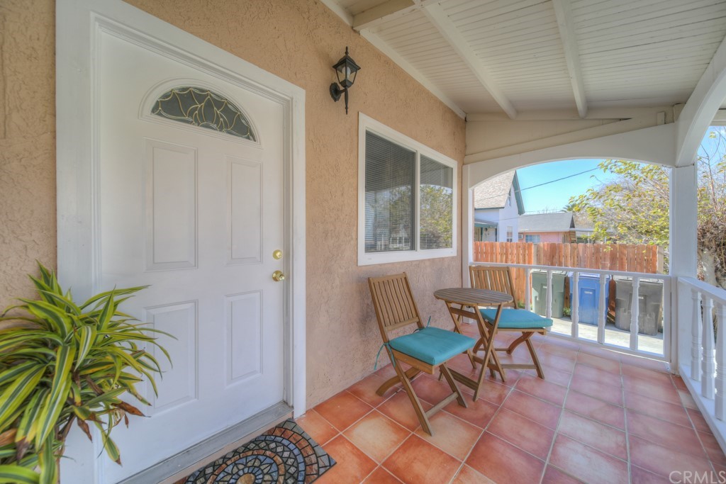 2450 Tenth Street Riverside, CA 92507 - Photo 1 of 1 a living room with furniture and a potted plant
