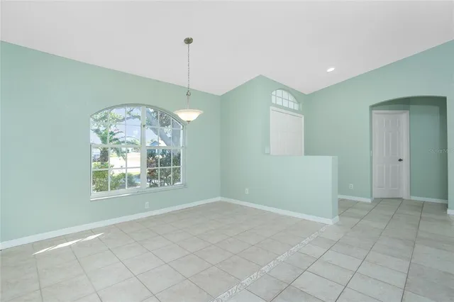 a bathroom with a shower sink vanity and toilet