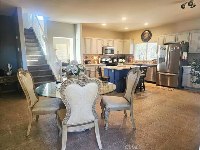 a dining room with furniture and window