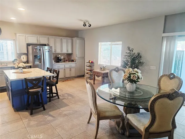 a dining room with furniture and window