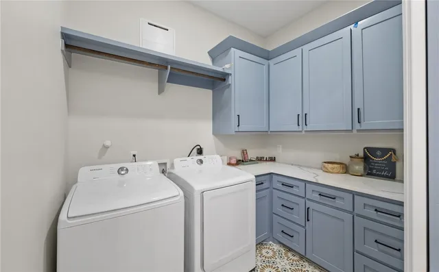 a utility room with dryer and washer