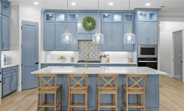 a kitchen with a table and chairs in it