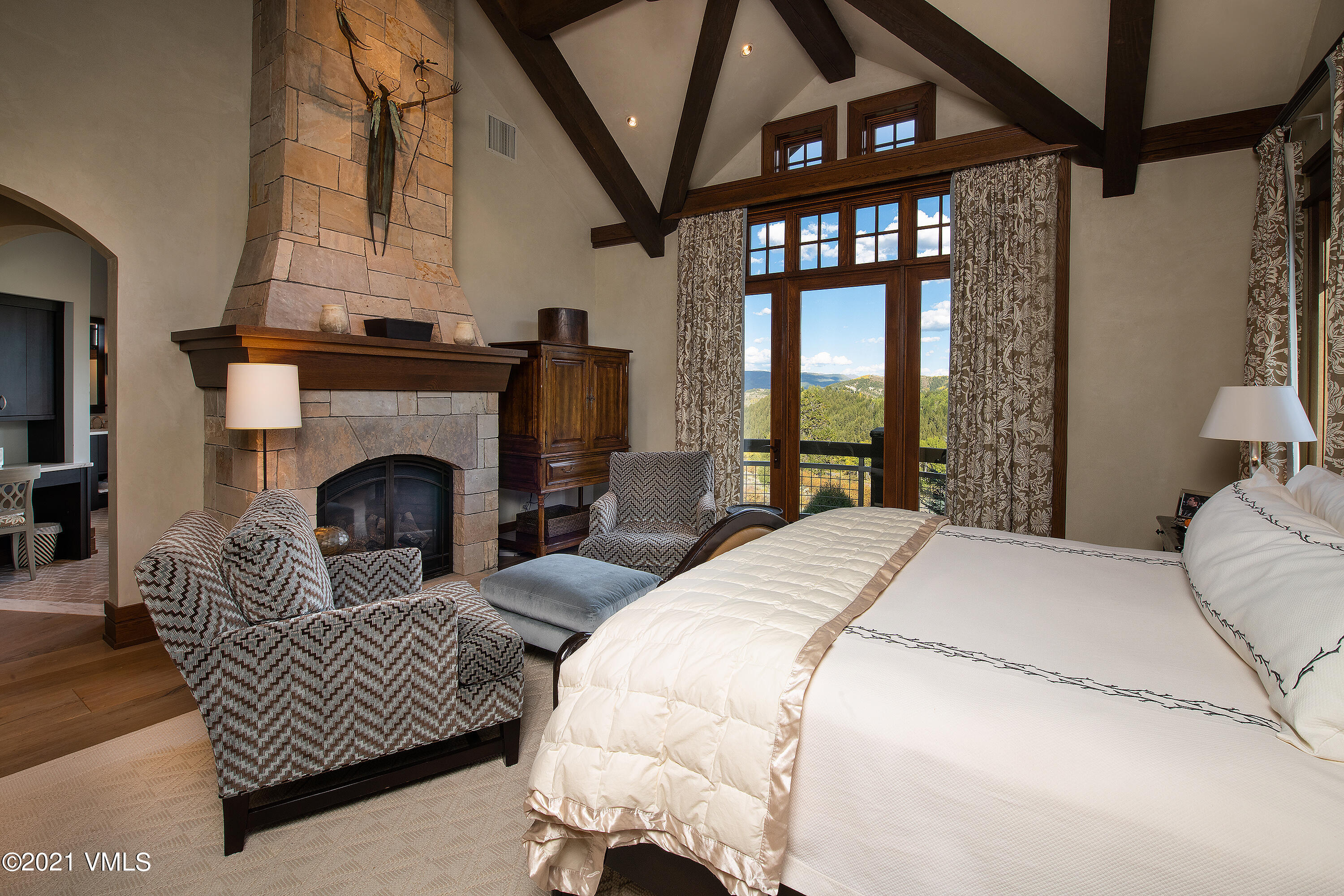 555 Red Draw Edwards, CO 81632 - Photo 12 of 24 a bedroom with a bed window and a fireplace
