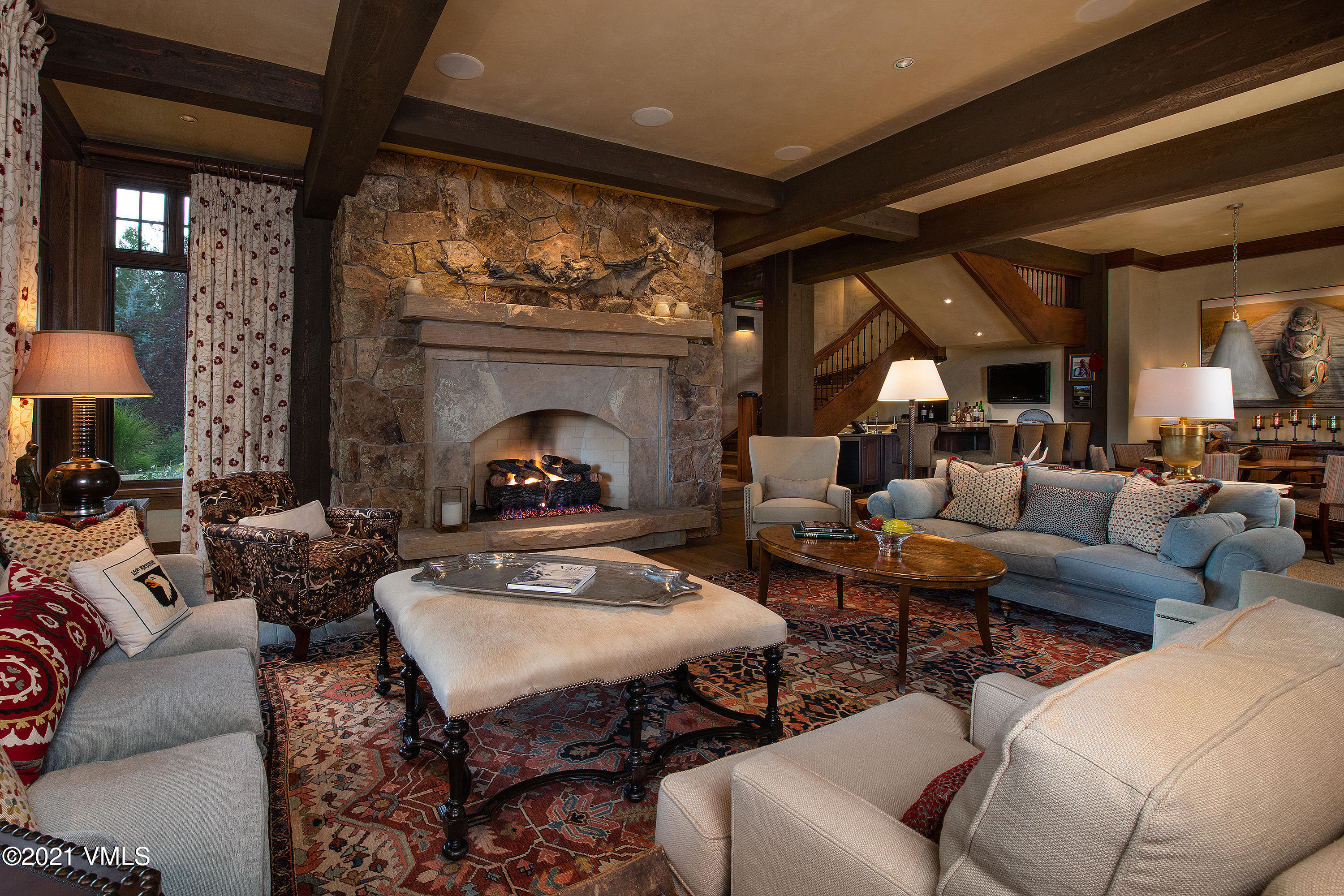 555 Red Draw Edwards, CO 81632 - Photo 15 of 24 a living room with furniture a fireplace and a large window