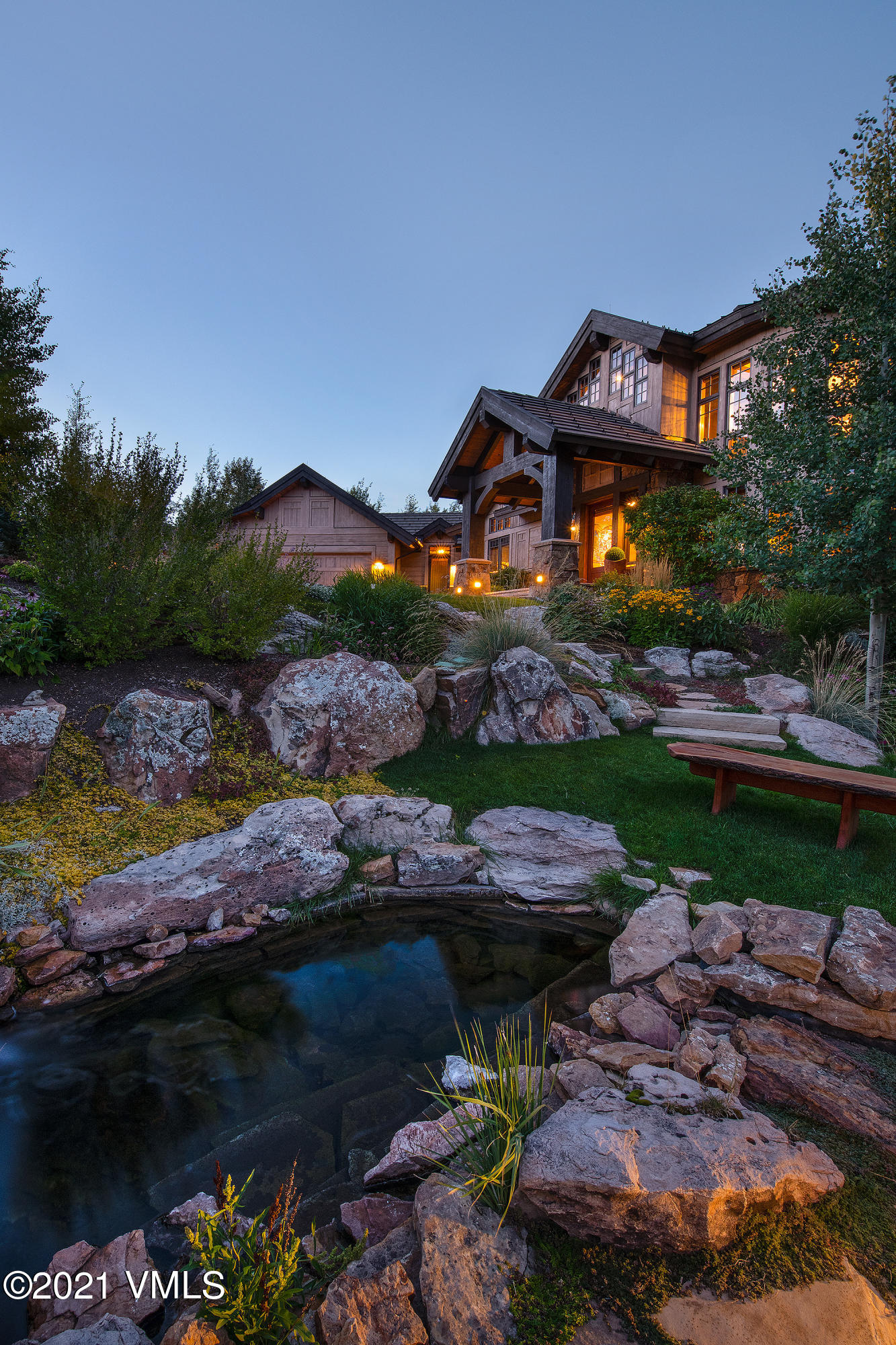 555 Red Draw Edwards, CO 81632 - Photo 16 of 24 a front view of a house with a garden and lake view