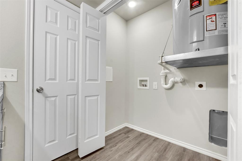 6108 Abrams Road, Unit 201 Dallas, TX 75231 - Photo 12 of 19 a view of a hallway with wooden floor