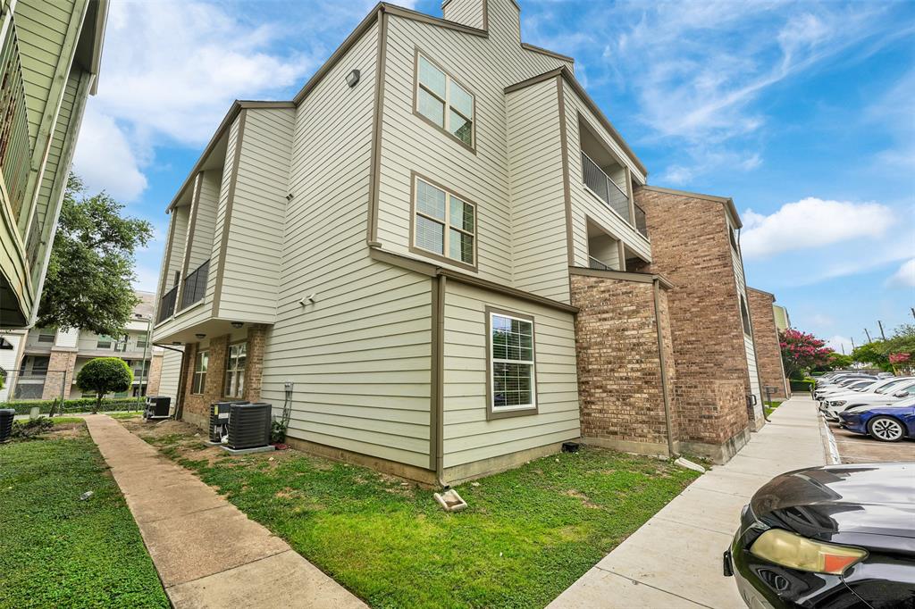 6108 Abrams Road, Unit 201 Dallas, TX 75231 - Photo 17 of 19 a view of a house with a yard