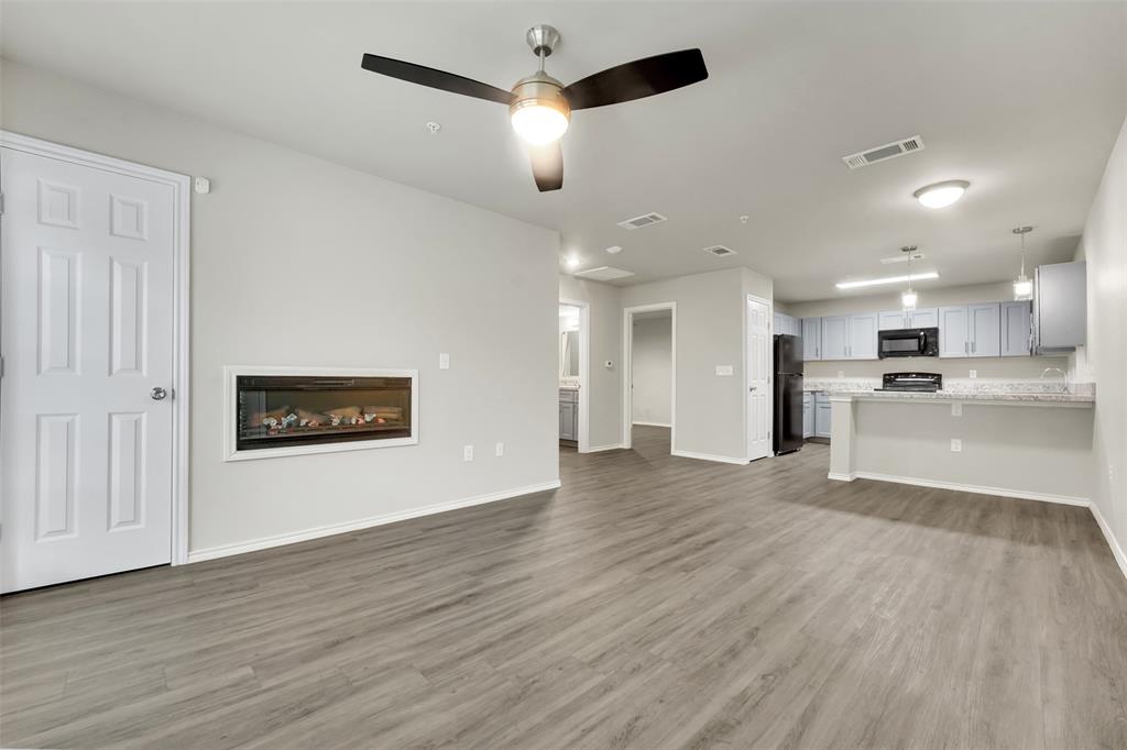 6108 Abrams Road, Unit 201 Dallas, TX 75231 - Photo 4 of 19 a view of an empty room and kitchen view