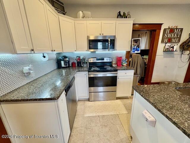 1200 Watson Street Scranton, PA 18504 - Photo 15 of 49 a kitchen with stainless steel appliances granite countertop a sink stove and refrigerator