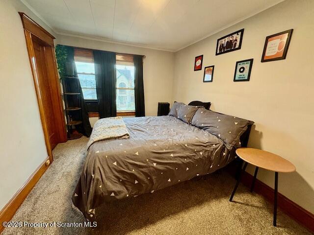 1200 Watson Street Scranton, PA 18504 - Photo 30 of 49 a bed sitting in a bedroom next to a window