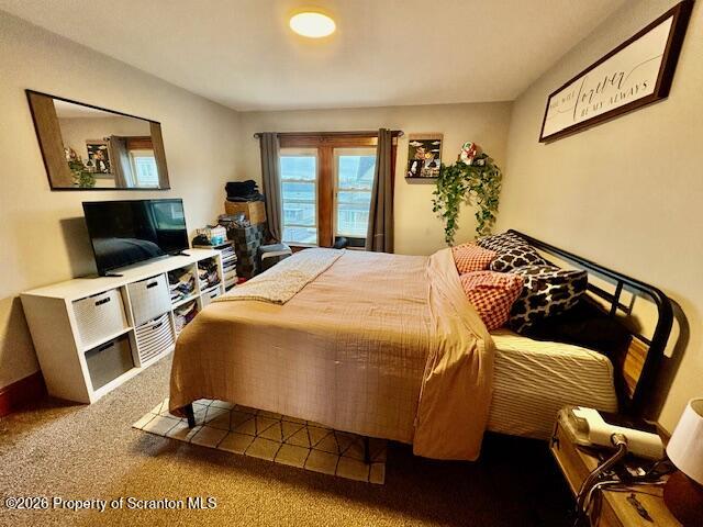 1200 Watson Street Scranton, PA 18504 - Photo 32 of 49 a bedroom with a bed and wooden floor