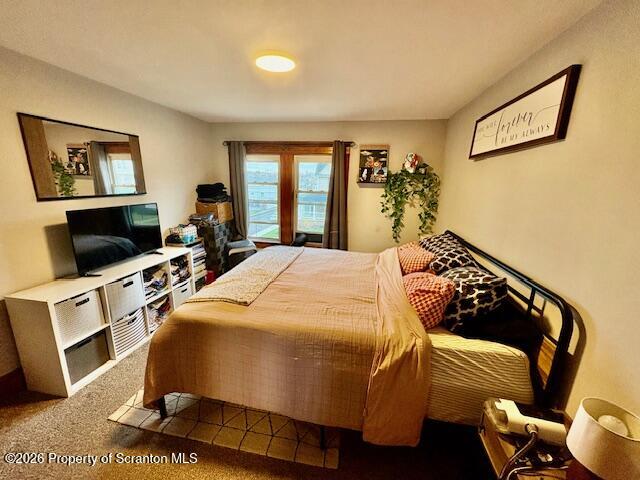 1200 Watson Street Scranton, PA 18504 - Photo 33 of 49 a bedroom with a bed and flat screen tv