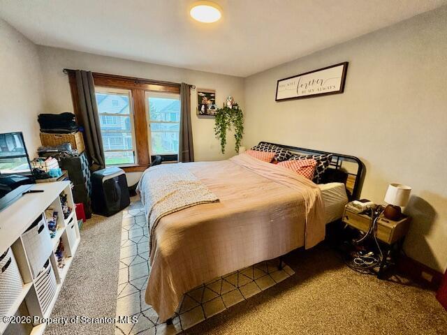 1200 Watson Street Scranton, PA 18504 - Photo 34 of 49 a bedroom with a bed and wooden floor