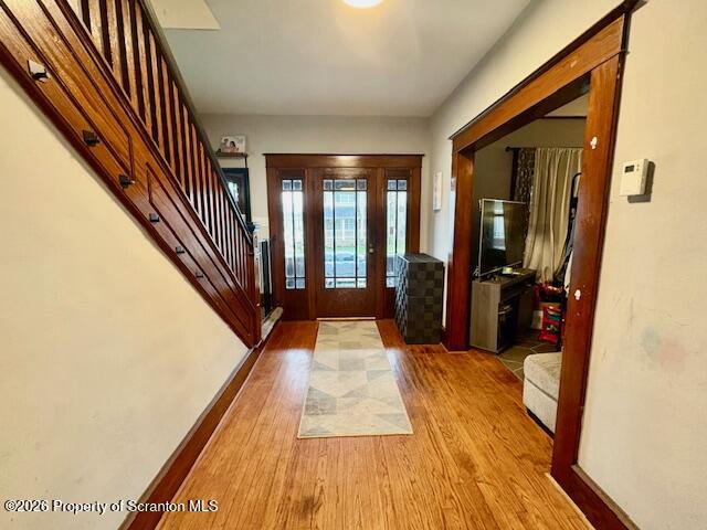 1200 Watson Street Scranton, PA 18504 - Photo 8 of 49 a hallway with wooden floor stairs and furniture