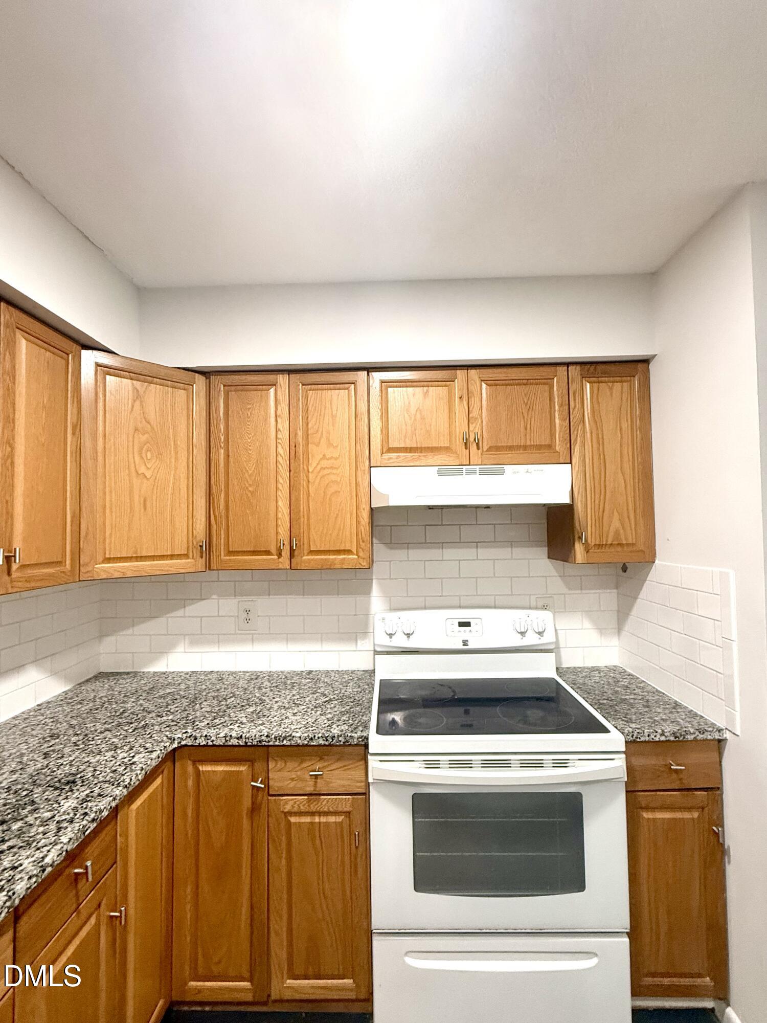 546 Pine Ridge Place Raleigh, NC 27609 - Photo 8 of 28 a kitchen with a stove and a sink