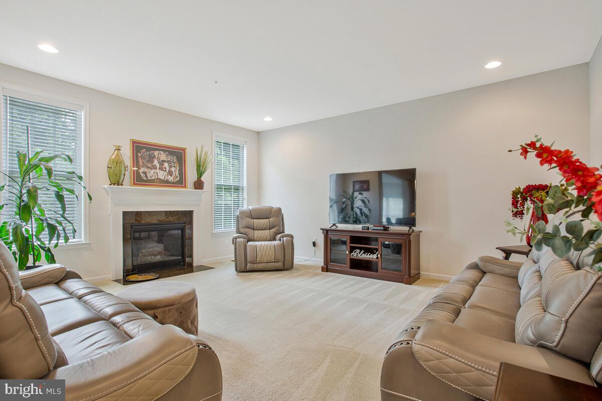 4006 Bridle Ridge Road Upper Marlboro, MD 20772 - Photo 15 of 45 a living room with furniture and a fireplace