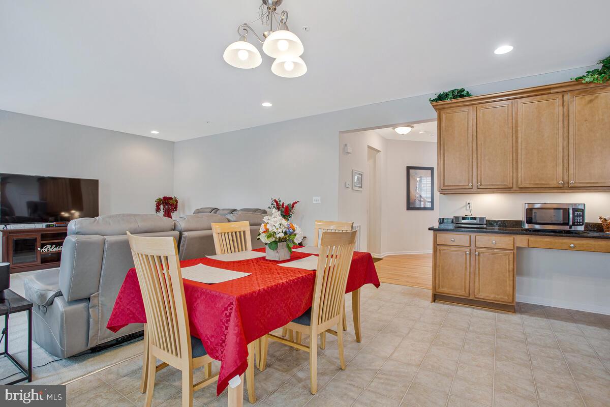 4006 Bridle Ridge Road Upper Marlboro, MD 20772 - Photo 18 of 45 a very nice looking kitchen with a dining table chairs stove top oven and sink