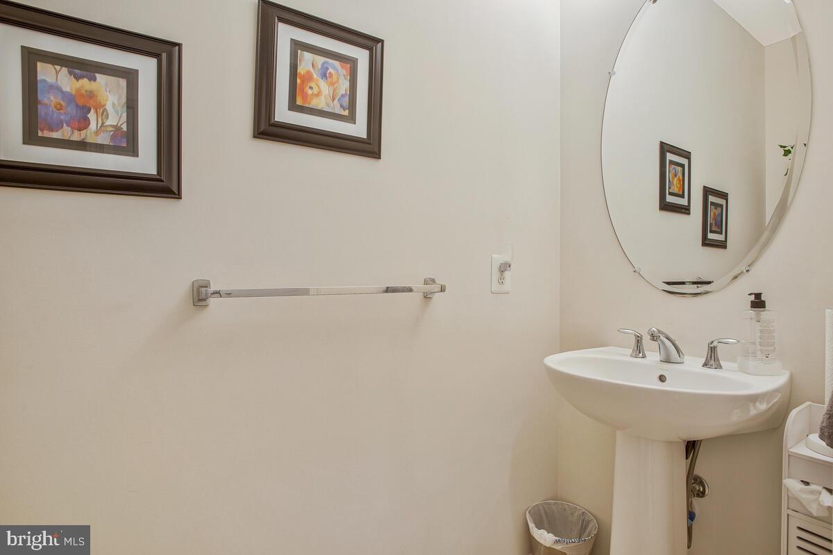 4006 Bridle Ridge Road Upper Marlboro, MD 20772 - Photo 21 of 45 a bathroom with a sink and mirror