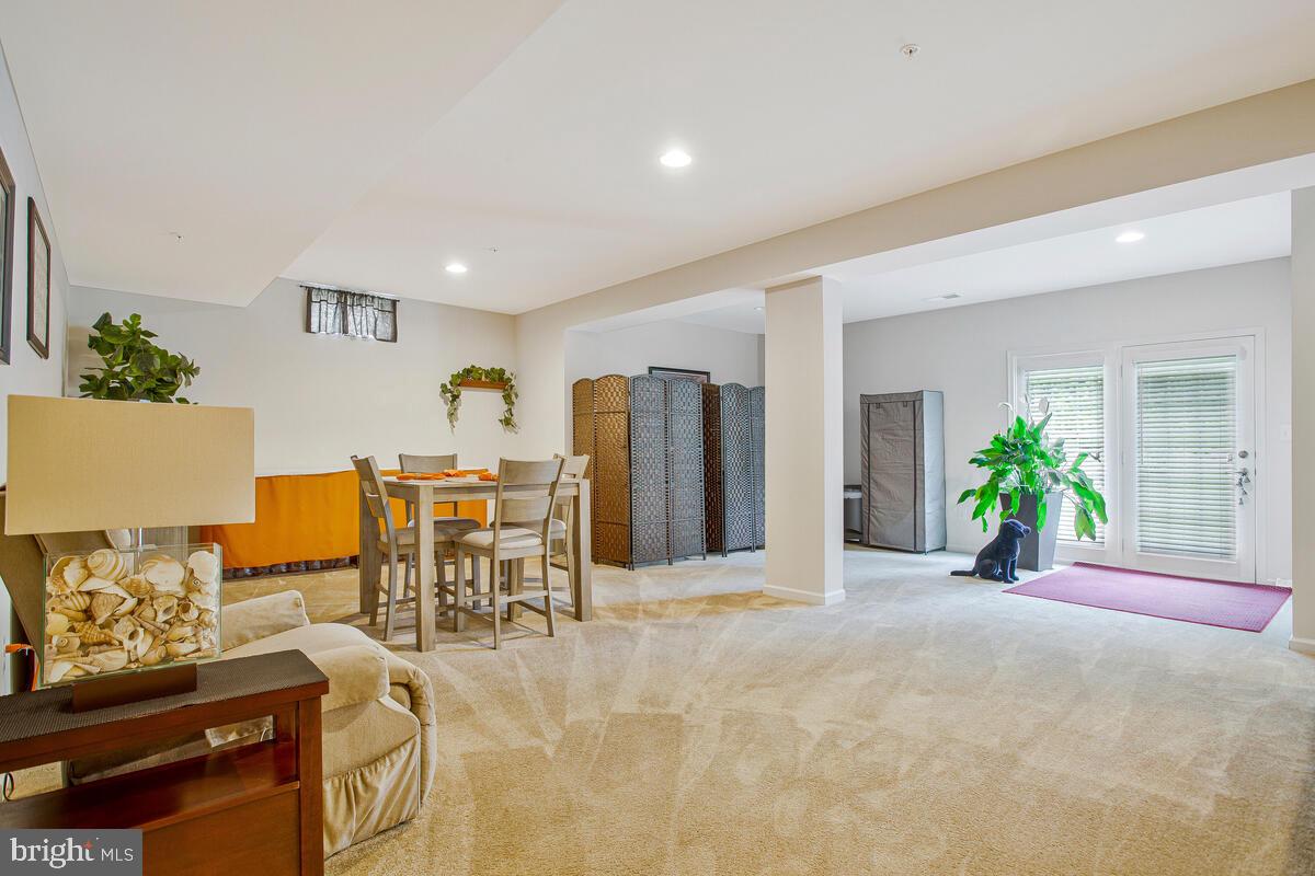 4006 Bridle Ridge Road Upper Marlboro, MD 20772 - Photo 26 of 45 a view of a livingroom with furniture and a potted plant