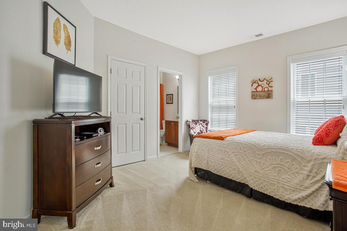 4006 Bridle Ridge Road Upper Marlboro, MD 20772 - Photo 28 of 45 a bedroom with a bed and a flat screen tv