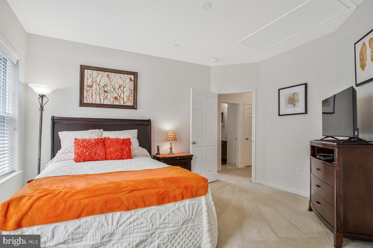 4006 Bridle Ridge Road Upper Marlboro, MD 20772 - Photo 29 of 45 a bedroom with a bed and a flat screen tv